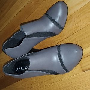 Gray and black heeled ankle bootie